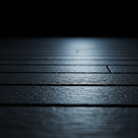 Wooden floor with light in the dark. Selective focus.の素材