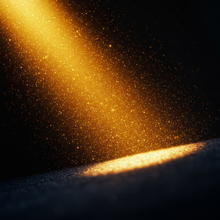 Glowing golden particles on black background. 3d render illustration.の素材