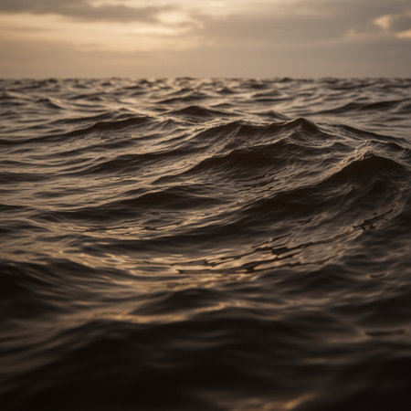 Water surface with waves at sunset. Beautiful natural background. Copy space.の素材