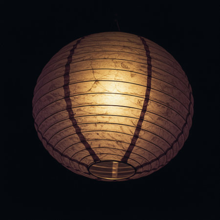 Chinese paper lantern on black background. Vintage style. Copy space.の素材