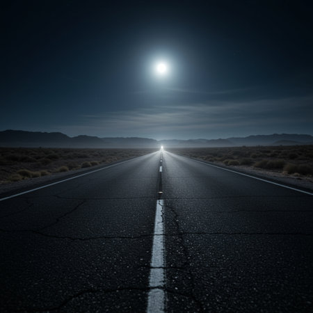 Road in the desert at night with full moon in the sky.の素材