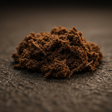 Pile of Pile of Ground Black Tea Powder on a dark background.の素材