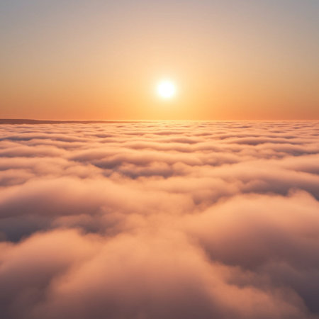 Sunset above the clouds. Aerial view of clouds at sunrise.の素材