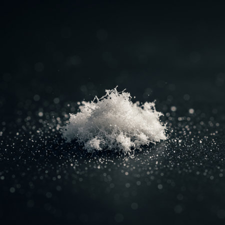 Close up of a pile of sugar powder on a black background.の素材