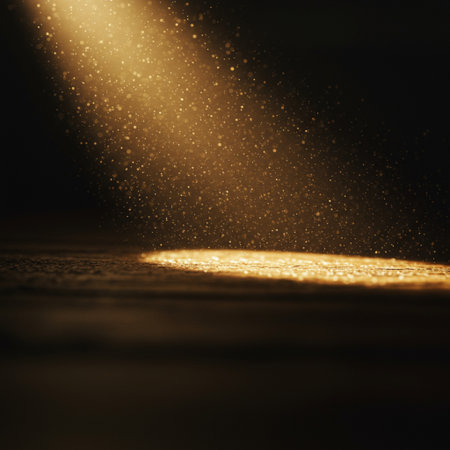 abstract scene of spotlight on dark background with sparks and golden lightsの素材