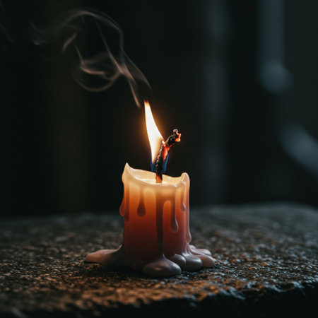 Burning candle on a dark background. The concept of aromatherapy.の素材