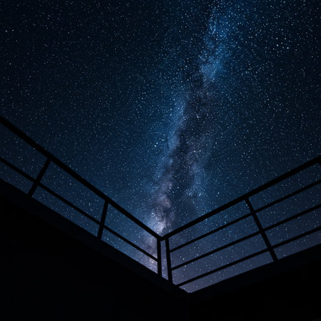 Milky way over a bridge in the night sky with stars.の素材
