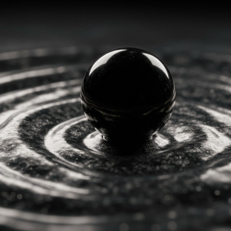 Black glass sphere on a black background with water drops. Macro shotの素材