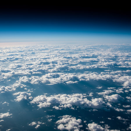 Aerial view of blue sky with white clouds and sunbeamsの素材