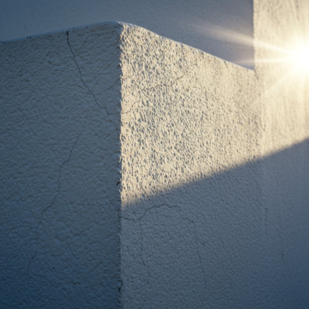White wall with sunlight. Architectural background. Shallow depth of field. Toned.の素材