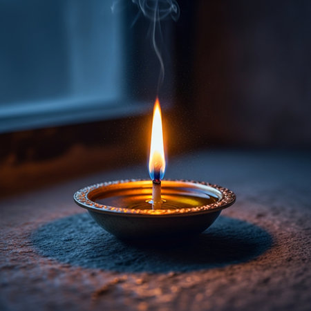 Beautiful diwali diya lit on colorful rangoli designの素材