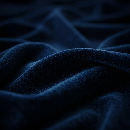 Blue velvet background. Close up photo of blue velvet fabric with wavesの素材