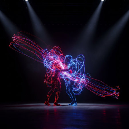 Silhouette of two dancers dancing in the dark with colored lightsの素材