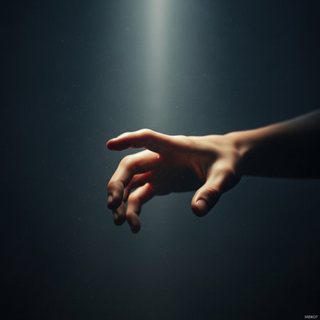 Human hand reaching out to the light. Conceptual image of hope.の素材
