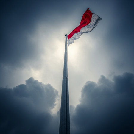 Indonesia flag waving in the wind with dramatic sky background.の素材