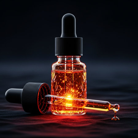 Dropper bottle with red liquid on black background. 3d renderingの素材
