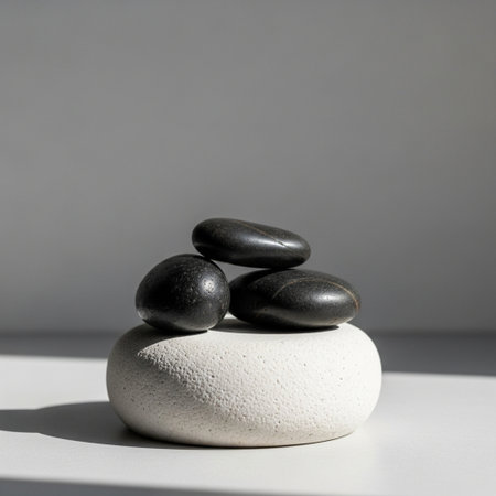 Black and white zen stones on grey background. Zen concept.の素材