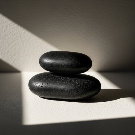 Spa stones with light and shadow on white background. Spa concept.の素材