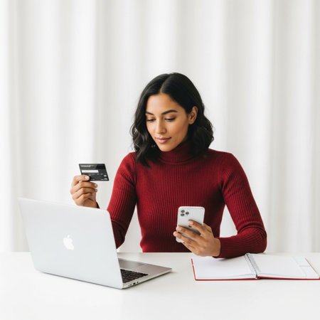 attractive asian woman using smartphone and credit card for online shopping at homeの素材