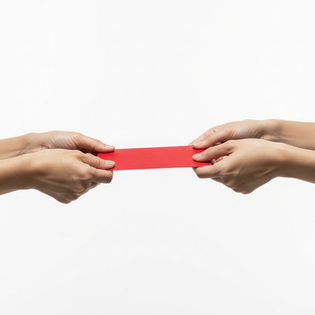 Hands holding red paper isolated on white background, clipping path includedの素材