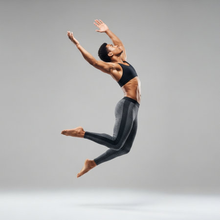 Young modern ballet dancer posing on a studio background. Full length portrait.の素材