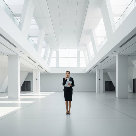 Full length portrait of young businesswoman using digital tablet in modern officeの素材