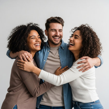 Happy multiethnic couple hugging and smiling at camera isolated on greyの素材