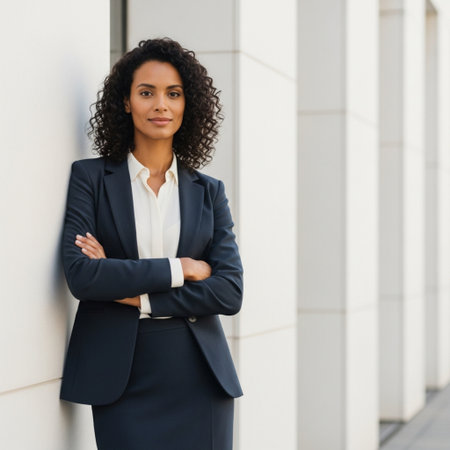 Portrait of a young african american businesswoman standing outside with arms crossedの素材