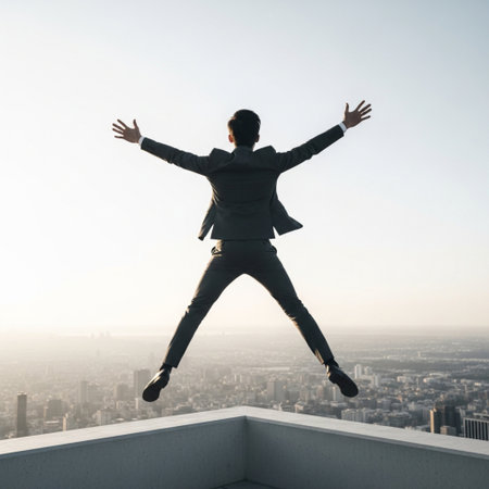 Businessman in suit jumping on roof with city view. Freedom conceptの素材