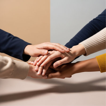 Close up of hands of business people holding each other on color backgroundの素材