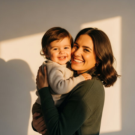 Portrait of a happy mother with her son on a white backgroundの素材
