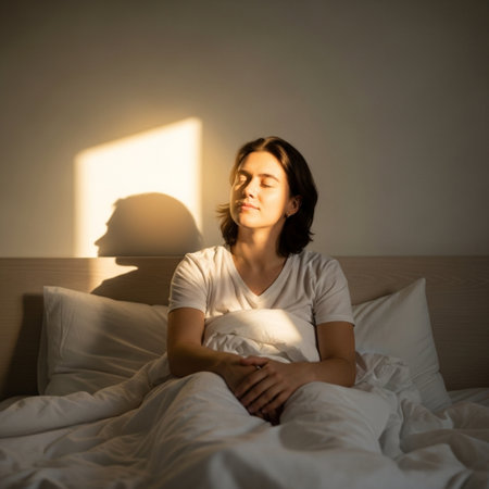 Pregnant woman sitting on the bed in the morning and looking at the sunの素材
