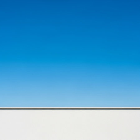 White wall with blue sky. Abstract background and texture for design.の素材