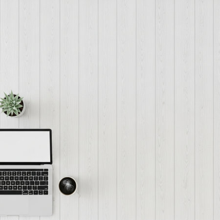 Top view of modern workspace with laptop, coffee cup and plant on white wooden background. Flat lay.の素材