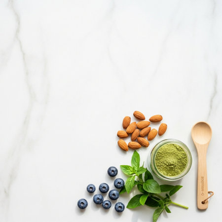 Healthy eating, dieting and nutrition concept - green matcha tea with blueberry and almondle backgroundの素材