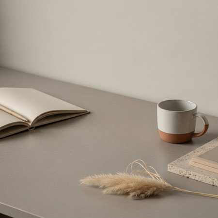 Office desk table with coffee cup, notepad and pampas grass.の素材