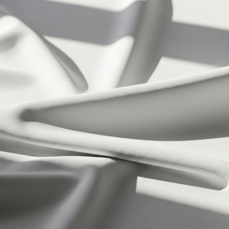 White silk fabric texture background. Close up of rippled white silk fabricの素材