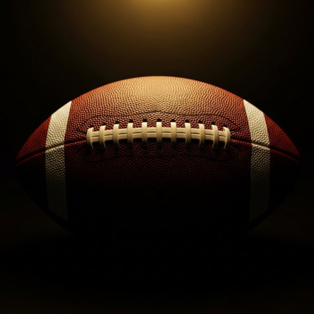 American football ball isolated on black background. 3d render illustration.の素材
