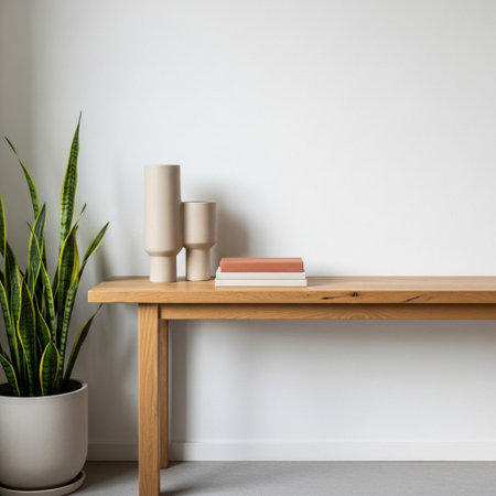 Interior of modern living room with wooden table, books and plantの素材