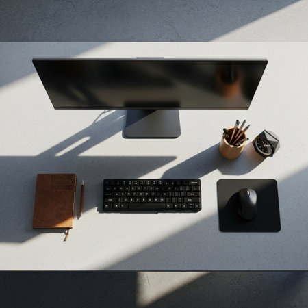 Top view of modern workplace with computer, stationery and copy space on concrete wall. Workplace conceptの素材
