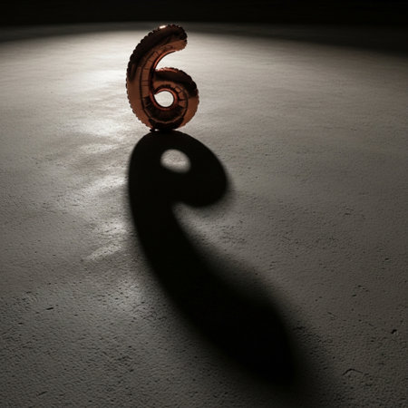 number six on the floor in a dark room with shadow and lightの素材