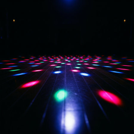 Colorful light trails on the floor in night club. Abstract background.の素材