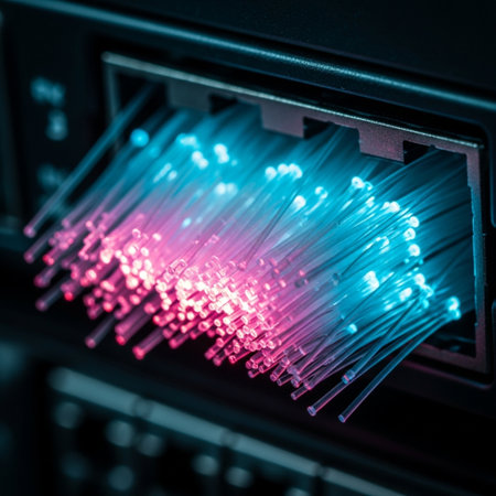 Fiber Optic cables connected to an optic ports in data centerの素材