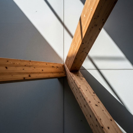Wooden beams on the ceiling of a modern office building with sunlight and shadowsの素材