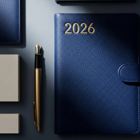 Notebook, pen and stationery on a blue background. Top view.の素材