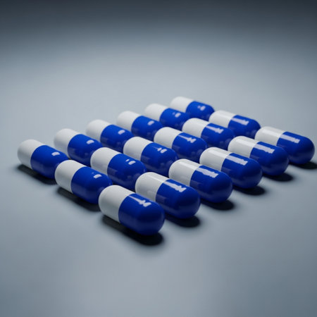Pills on a blue background. Focus on foreground, soft bokeh.の素材