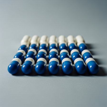 Blue and white pills on a gray background. Close-up.の素材