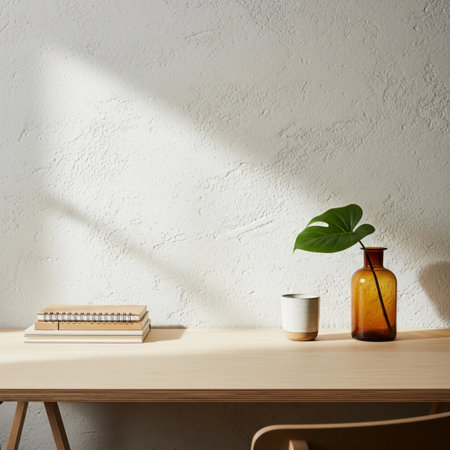 Wooden table with coffee cup, book and plant on it.の素材