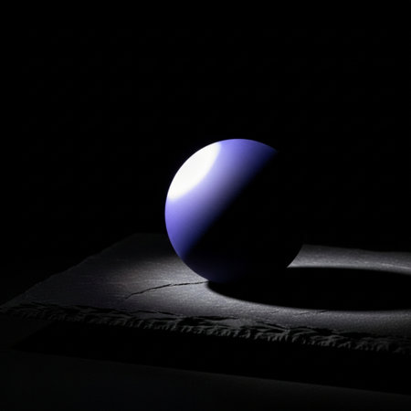 Blue ball on a black background in the light of the lamp.の素材