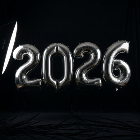 Silver balloons with numbers 2020 on black background. New year concept.の素材